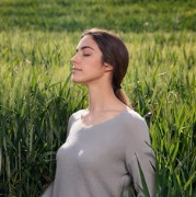Woman breathing in a wheat field
