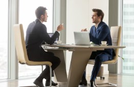 Two professionals in conversation